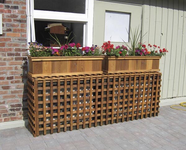 Esconder aire acondicionado decoración con madera y plantas